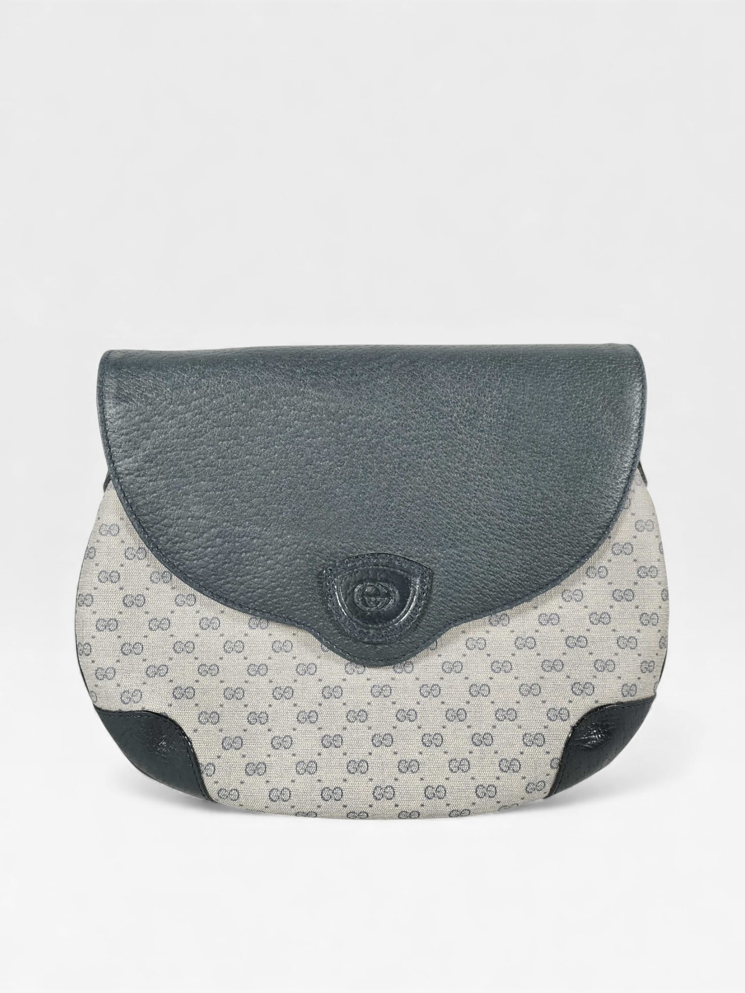 Gucci Micro Monogram Leather and Canvas Shoulder Bag: Authentic vintage Gucci Micro GG monogram blue canvas and leather shoulder bag. The gorgeous gold tone hardware sparkles on this piece. The quality of vintage Gucci is really something else. You can n