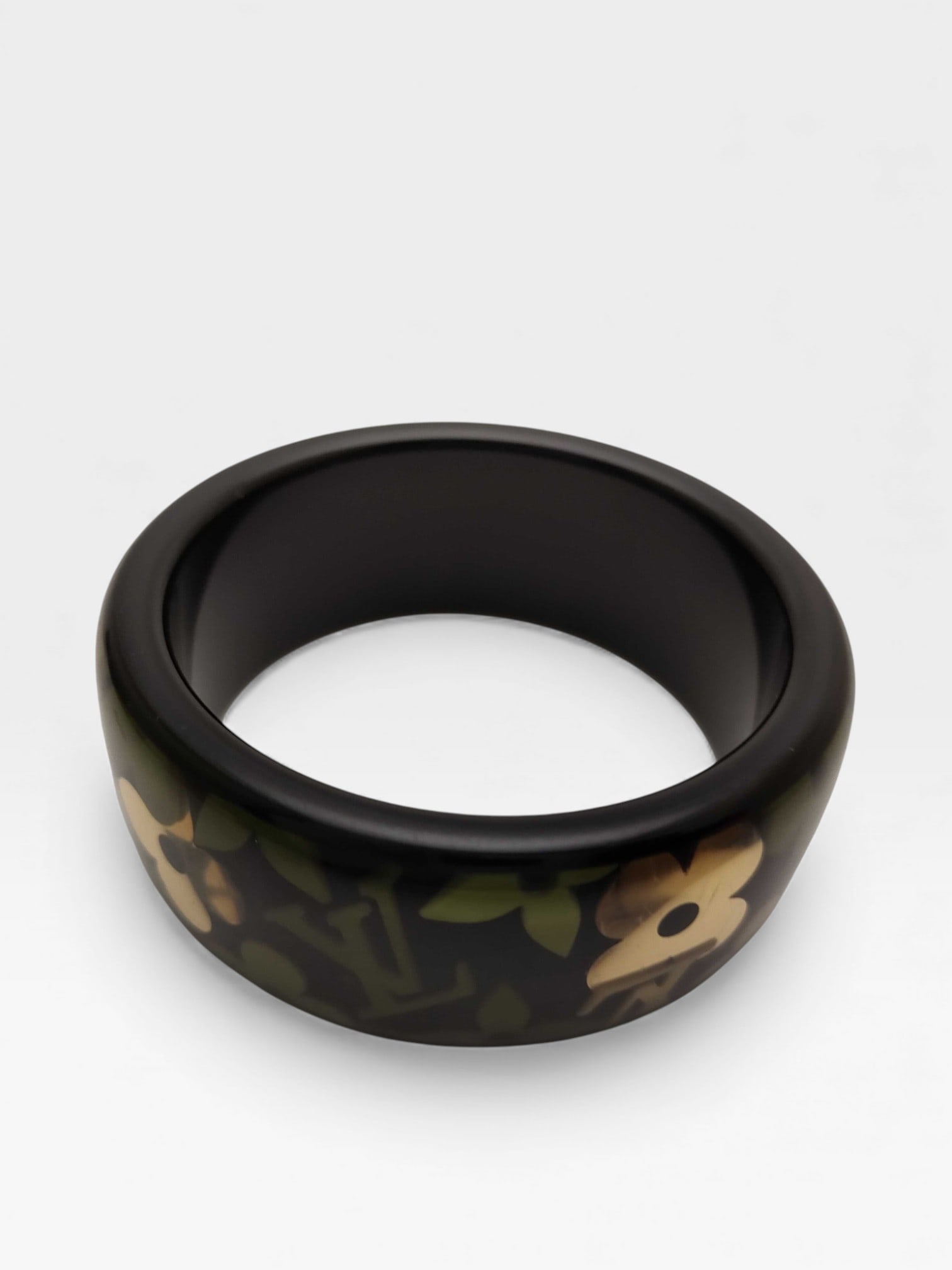 Louis Vuitton Farandole Monogram Bangle Bracelet with Box & Card: Authentic Louis Vuitton Farandole Monogram Bangle Bracelet in black resin with green and gold-tone monogram flowers.