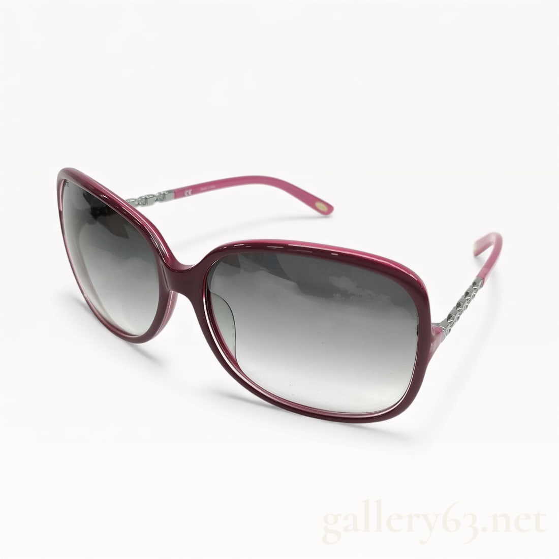 Loewe SLW8189 Burgundy Gradient Lens Sunglasses: Authentic Loewe SLW8189 sunglasses having a rectangular oversized frame in translucent burgundy plastic. Gray gradient lenses featuring darker tint at top fading lighter toward bottom. Temples in matc