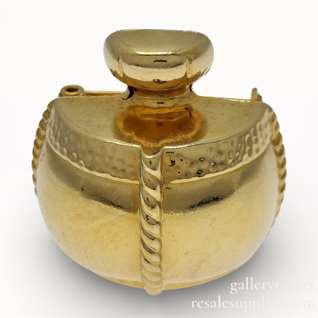 Yves Saint Laurent Gold-Plated Perfume Bottle Brooch: Authentic Yves Saint Laurent Gold-Plated Perfume Bottle Brooch. Yves Saint Laurent brooch having a gold-plated sculptural perfume bottle form. Rounded body featuring textured and smooth surface detail