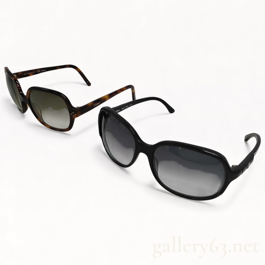 Chloé Sunglasses Set of Two with Cases: Chloé sunglasses set consisting of two pairs. First pair having a rectangular frame in tortoiseshell acetate fitted with green-tinted lenses. Second pair having a rounded oversized frame in glo