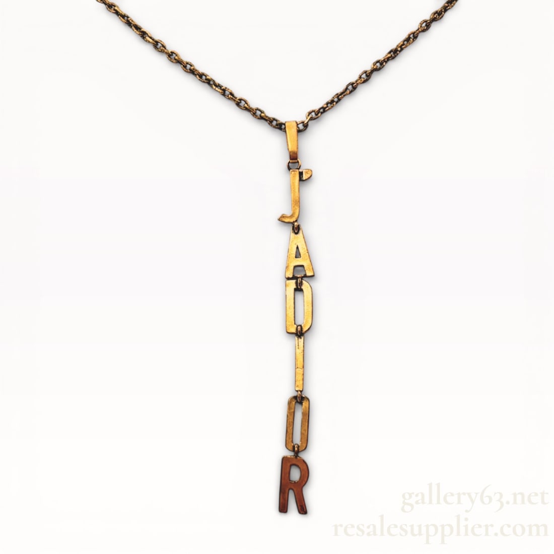 Dior J’ADior Logo Y Drop Necklace Aged Gold Tone Authentic: Authentic Dior necklace having an aged gold-tone chain with a vertical Y-drop pendant. Pendant formed from linked letter elements spelling J’ADior in mixed metal tones. Elongated linear drop suspend