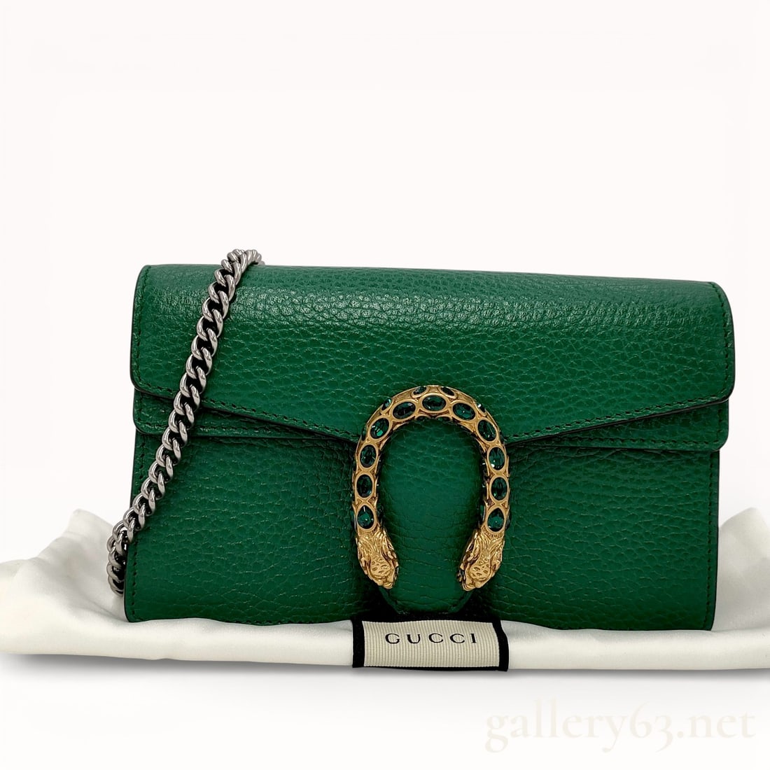 Gucci Emerald Green Leather Dionysus Super Mini Shoulder Bag: Authentic Gucci Dionysus Super Mini bag in green leather with gold rhinestone jeweled horseshoe on beautiful palladium tone hardware and full palladium tone chain. This is the desirable Super Mini siz