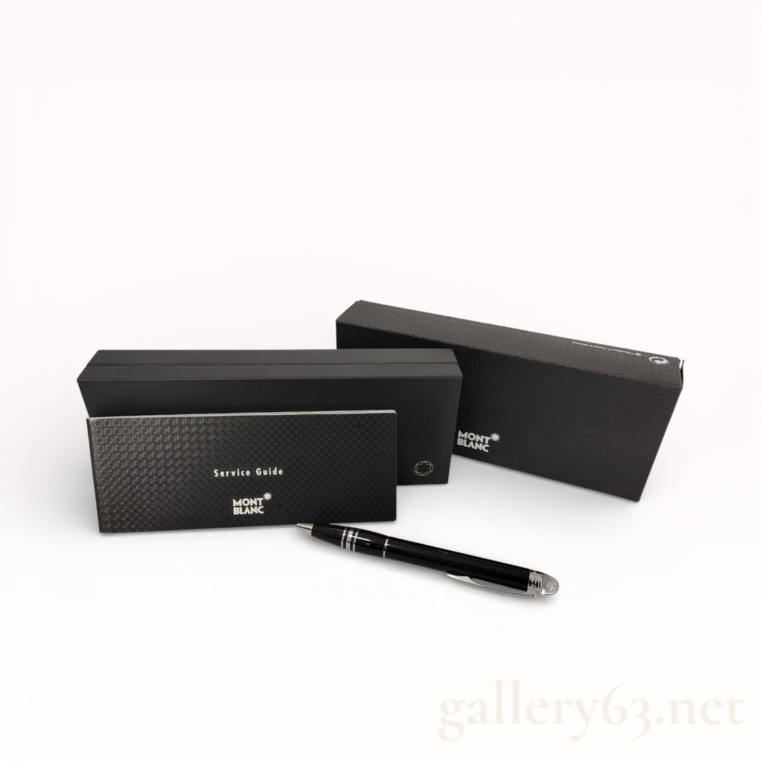 Montblanc Black Resin Rotary Ballpoint Pen With Clear Dome Finial and Box: Authentic Montblanc rotary ballpoint pen having a black resin body with high-gloss finish. Pen featuring a clear dome finial set with the Montblanc white star emblem. Polished metal trim present at th