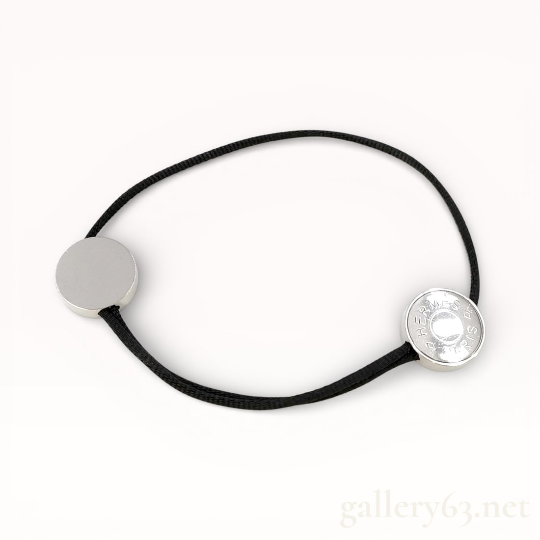 Authentic Hermes Tournis Palladium and Cord Bracelet 7 inch:  Authentic Hermes Tournis cord bracelet in black cord and palladium-plated hardware, comfortably fits a 7 inch wrist. 