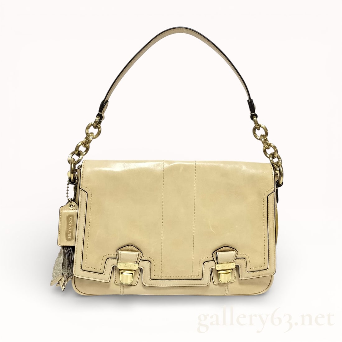 Coach 17925 2-Way Light Cream Leather Shoulder Bag: Coach shoulder bag crafted of light cream leather. Bag having a structured rectangular silhouette with flap front. Set with a single leather shoulder strap featuring chain hardware segments. Front sec