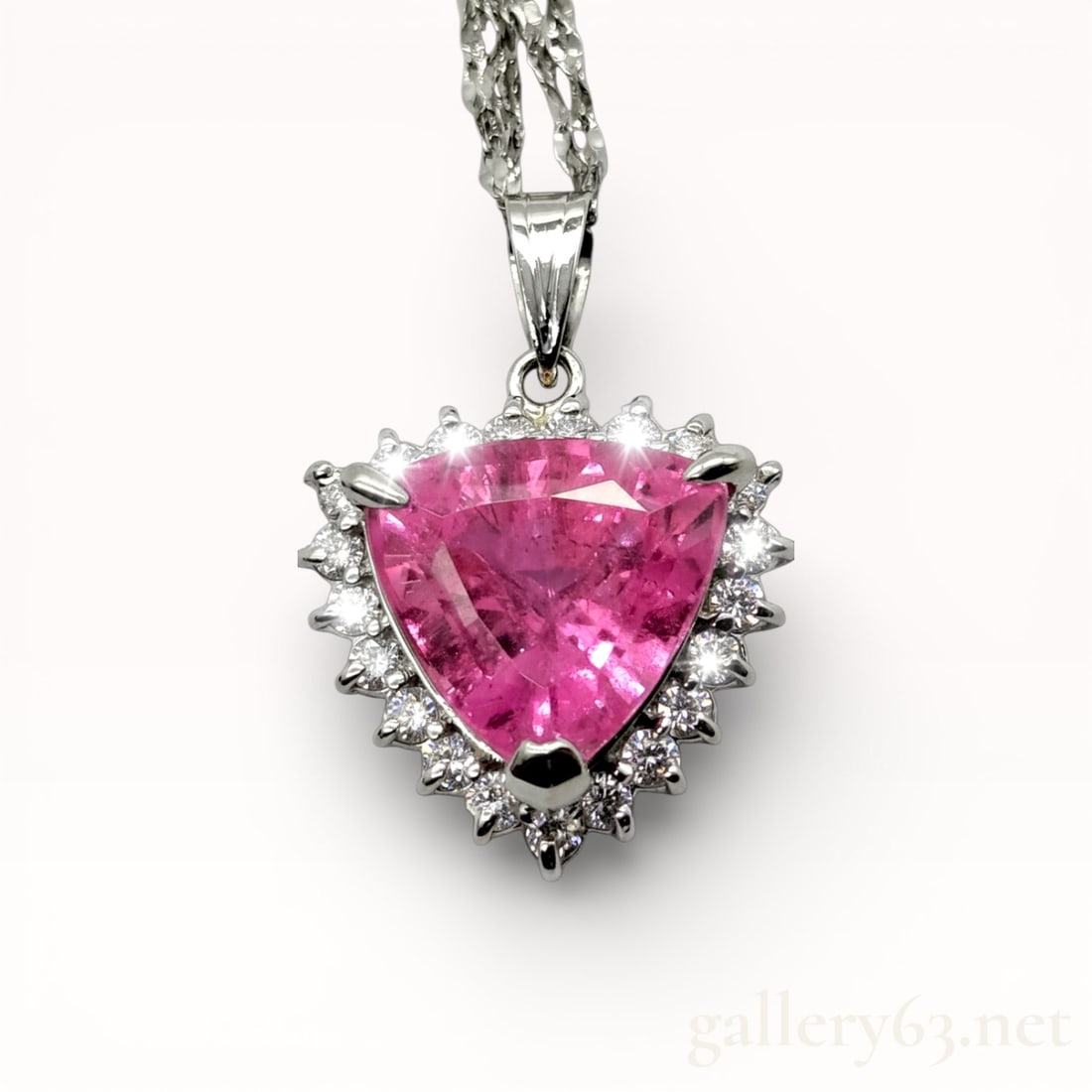 Trillion Cut 3.36ct Pink Tourmaline Solitaire Pendant with Diamonds in Platinum 16,5 In Chain: Authentic Trillion Cut 3.36ct Pink Tourmaline Solitaire Pendant with Diamonds in Platinum 16,5 In Chain. Total weight of the brillaint cut white diamonds is .39 carats. 850 platinum pendant and chain