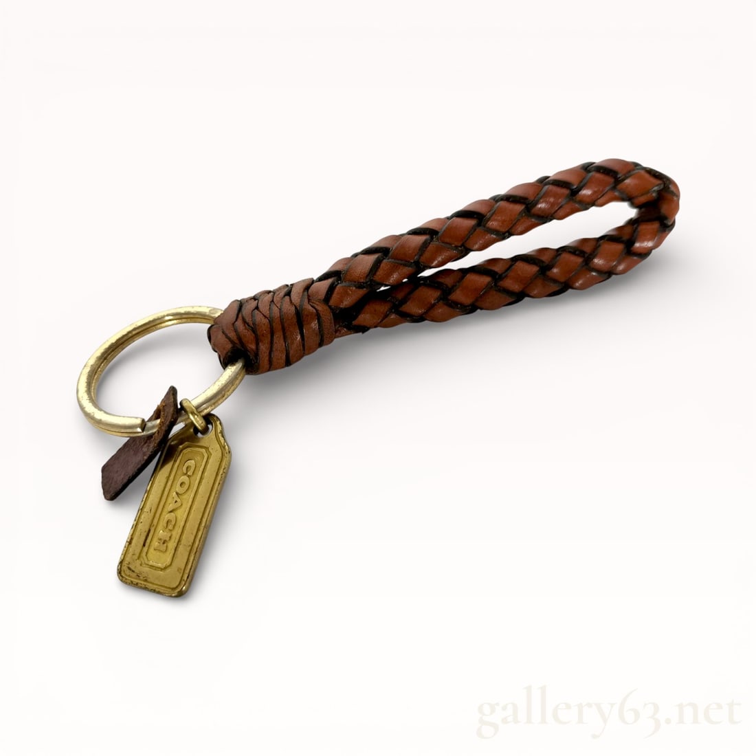 Coach Woven Leather Keychain: Authentic Coach woven leather keychain with gold tone Coach medallion tag.