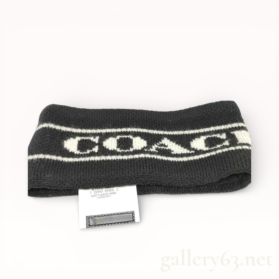 Coach Knit Logo Hair Band: Coach knit hair band having black elastic knit construction. Design featuring white Coach logo text and horizontal stripe detailing. Pull-on headband style. Textile tag present. NWT