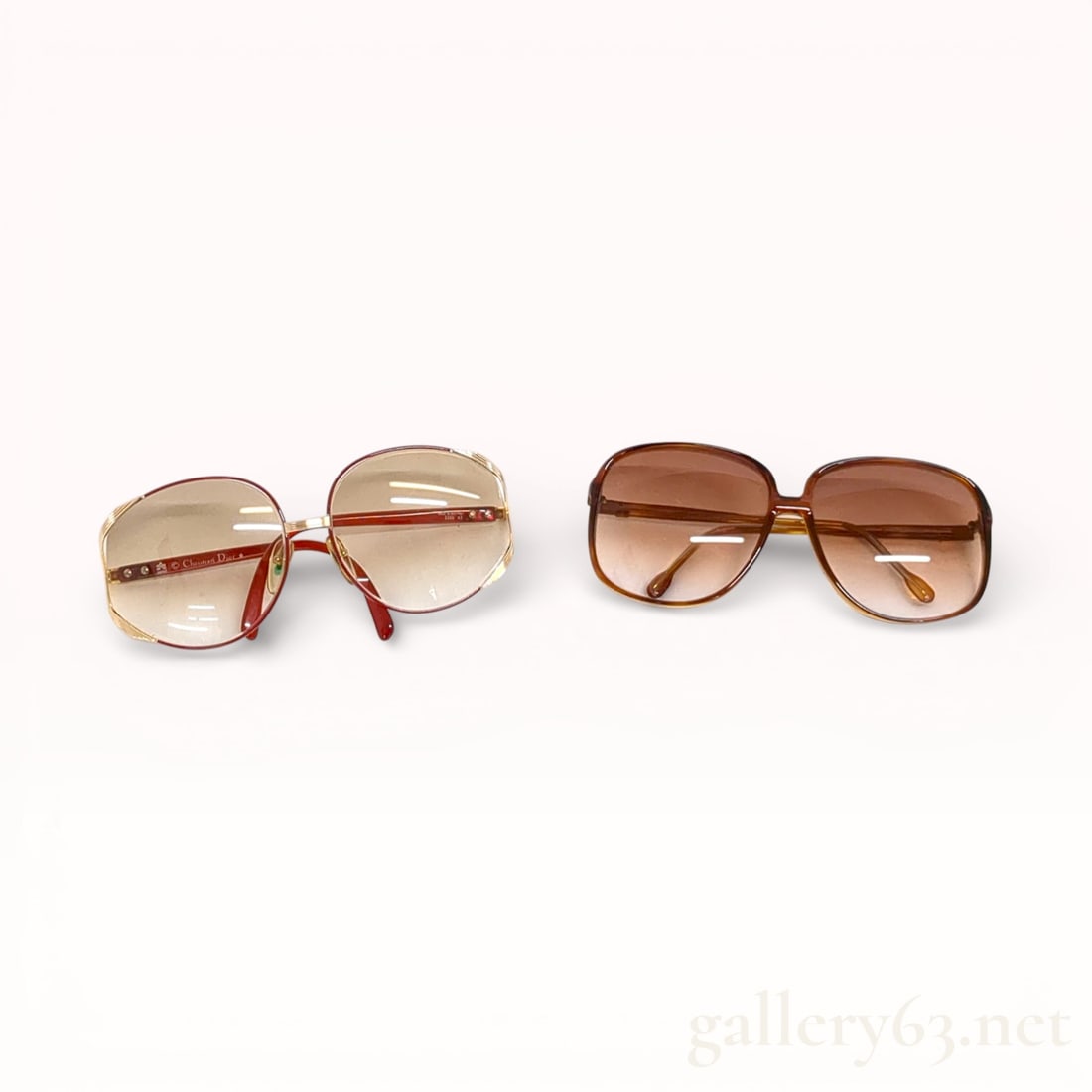 Dior And Calvin Klein Sunglasses – 2 Pairs – Mixed Styles: Lot of two pairs of sunglasses including one Dior pair and one Calvin Klein pair. Group featuring oversized frames in mixed materials and warm-toned lenses. Dior pair having gradient lenses and brande