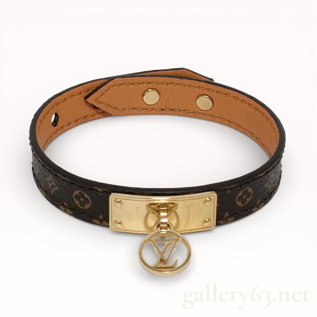 Louis Vuitton Monogram Logo Mania Bracelet Bangle 7": Authentic Louis Vuitton monogram logo mania bracelet bangle crafted in coated canvas featuring the classic monogram pattern throughout. Structured band form having a leather-lined interior and adjusta