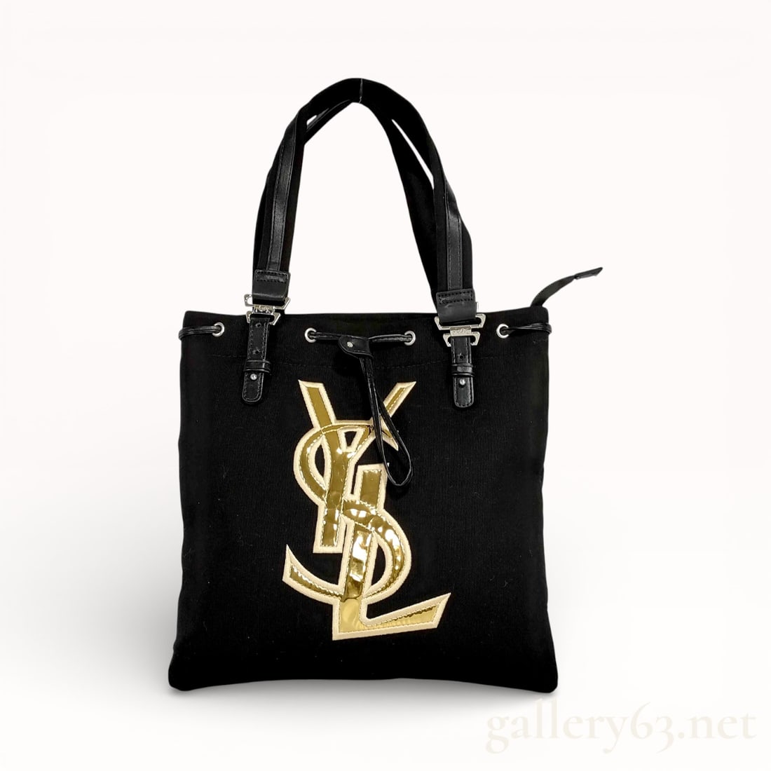 YSL Yves Saint Laurent Black and Gold Leather and Canvas: Authentic vintage YSL monogram Yves Saint Laurent black canvas tote bag with a large gold-toned YSL logo and leather handles.