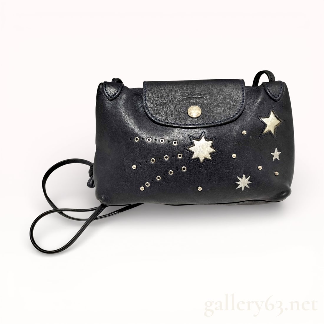 Le Pliage Cuir Etoile Star Leather Satchel: Authentic black leather Longchamp Le Pliage crossbody bag with silver-tone star and dot embellishments. Le Pliage Cuir Etoile Star Leather Satchel