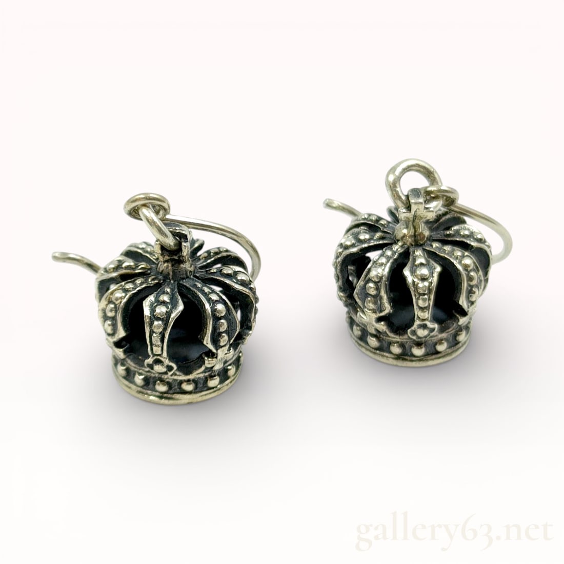 Justin Davis Crown Motif Sterling Silver Earrings: Authentic Justin Davis earrings crafted in sterling silver marked SV925. Pair featuring three-dimensional crown motifs with openwork construction and darkened recessed detailing. Hinged drop-style des