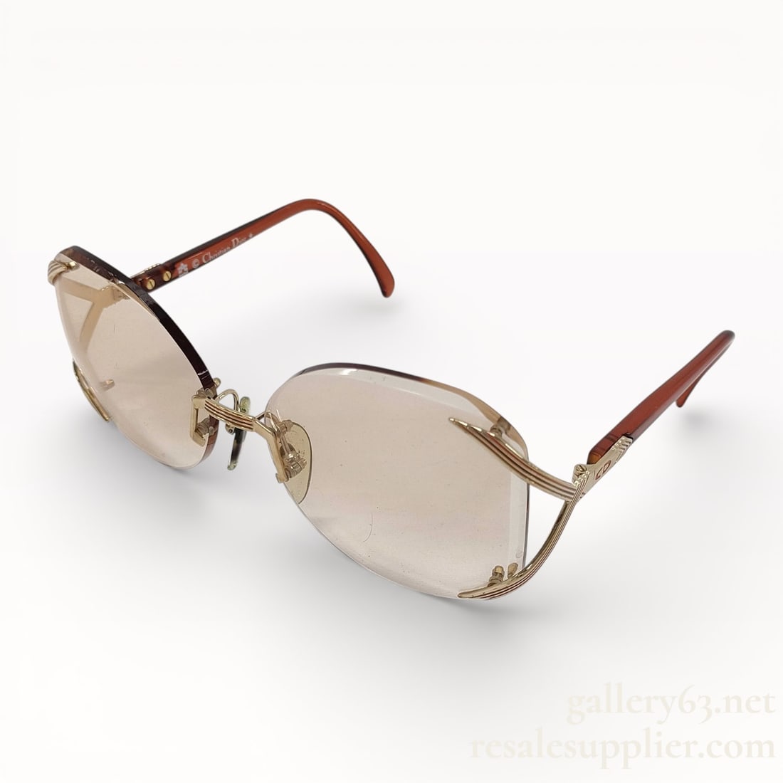 Christian Dior 2289 Brown Sunglasses: Authentic Christian Dior 2289 Brown Sunglasses Description Metal-framed sunglasses having lightly tinted brown lenses in a rounded rectangular shape. Gold-tone metal bridge and rimless-style len
