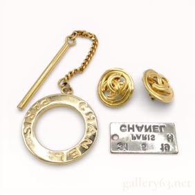 Collection of Chanel Gold-Tone Pendant Top, Earrings, and Scarf Ring Set