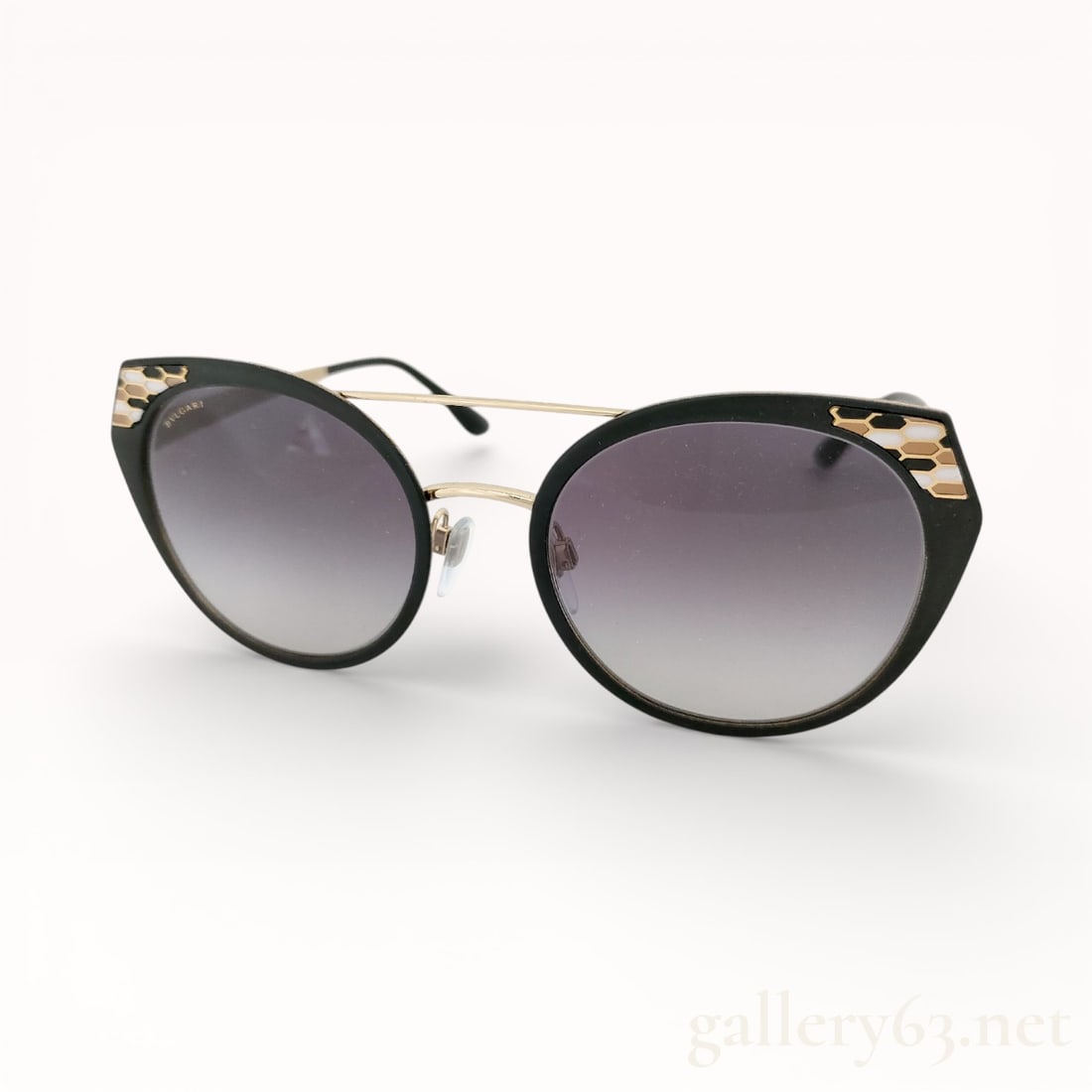 Bvlgari Serpenti Round Sunglasses: Authentic Bvlgari Sunglasses featuring rounded frames in black acetate with softly contoured rims. Gradient tinted lenses transitioning from dark to lighter tones. Slim gold-tone metal bridge and temp