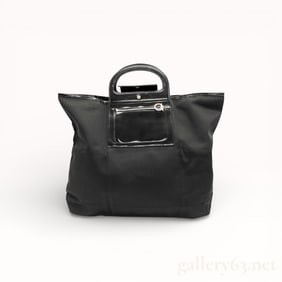 Salvatore Ferragamo Gancini foldable tote bag in black nylon with leather trim.