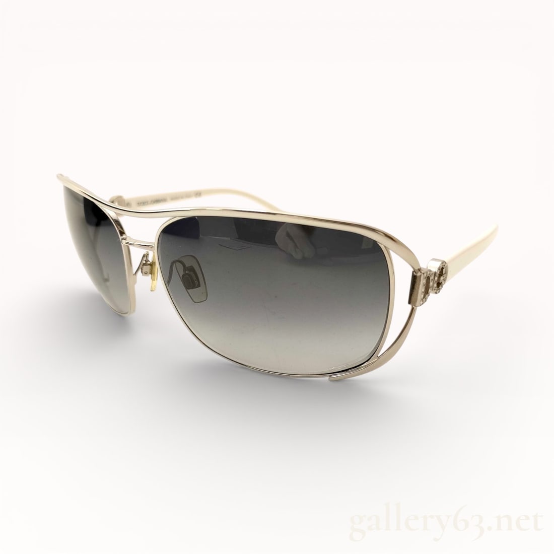 Dolce & Gabbana DG2017-B Metal Frame Sunglasses: Authentic Dolce & Gabbana Sunglasses featuring a rectangular silhouette set within a polished silver-tone metal frame. Gradient gray lenses transitioning from dark to light tones. Slim metal arms exte
