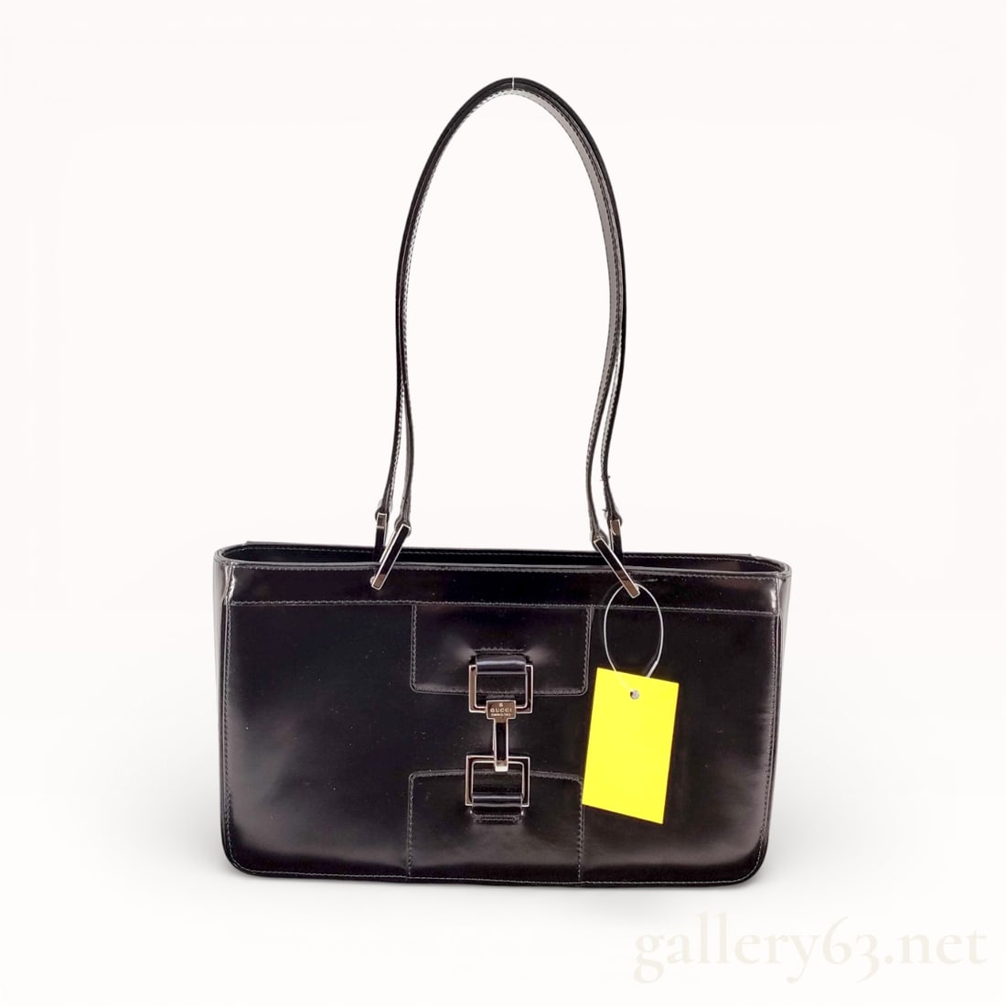 Gucci Jackie 002 Leather Shoulder Bag With Silver Hardware: Authentic Gucci Jackie 002 shoulder bag crafted in black leather having a structured rectangular silhouette. Front featuring the signature Jackie push-lock closure set with silver-tone hardware. Smoot