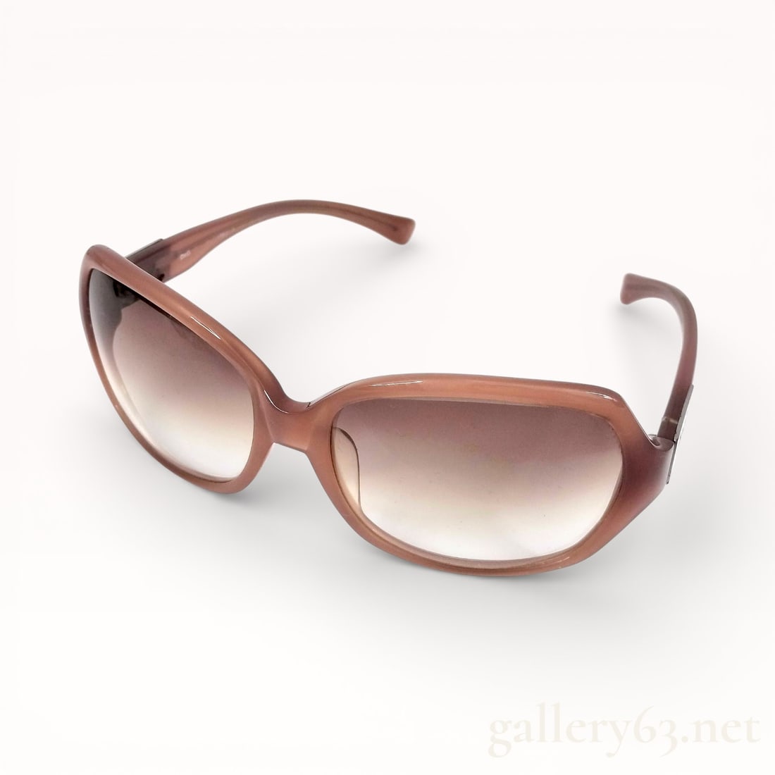 Dolce & Gabbana DD3016 Brown Gradient Sunglasses: Authentic Dolce & Gabbana Sunglasses featuring a softly squared frame in brown acetate. Gradient lenses transitioning from dark to lighter tones. Smooth, rounded rims paired with gently curved arms ex