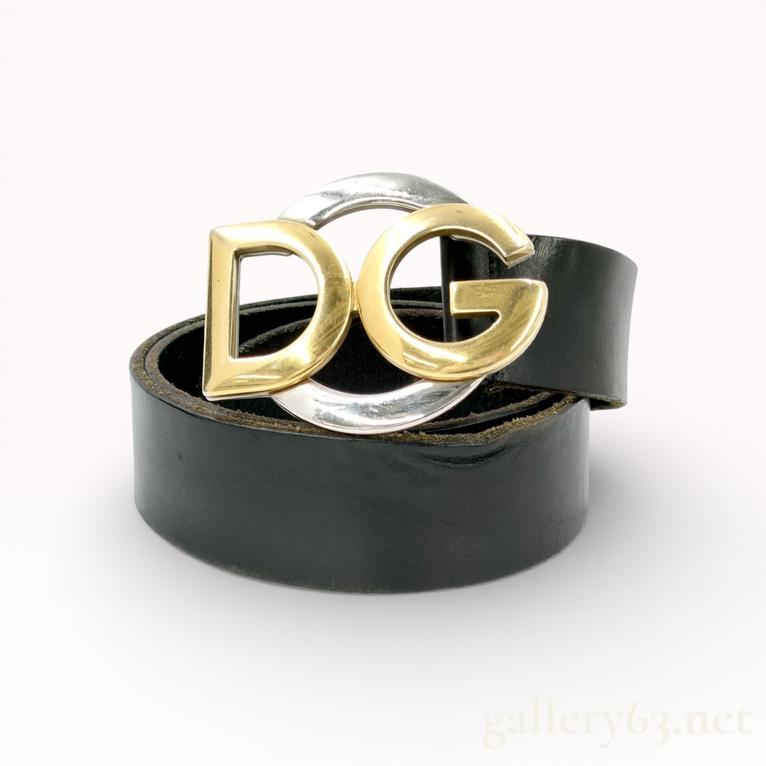Dolce & Gabbana Leather Belt with DG Logo Buckle: Authentic Dolce & Gabbana Leather belt featuring a wide black leather strap with smooth finished edges. Polished metal buckle composed of interlocking gold-tone “DG” letters set within a circu
