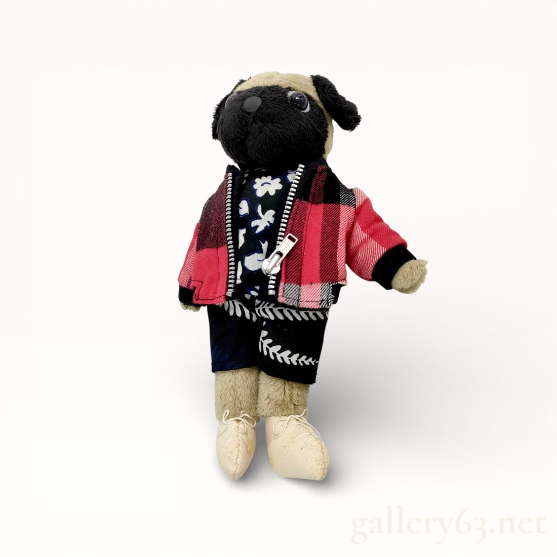 Sacai Animal Plush Charm: Plush animal charm by Sacai. Soft textile figure styled with layered clothing including a patterned jacket and contrasting garments. Finished with stitched facial details and fabric limbs. Fitted