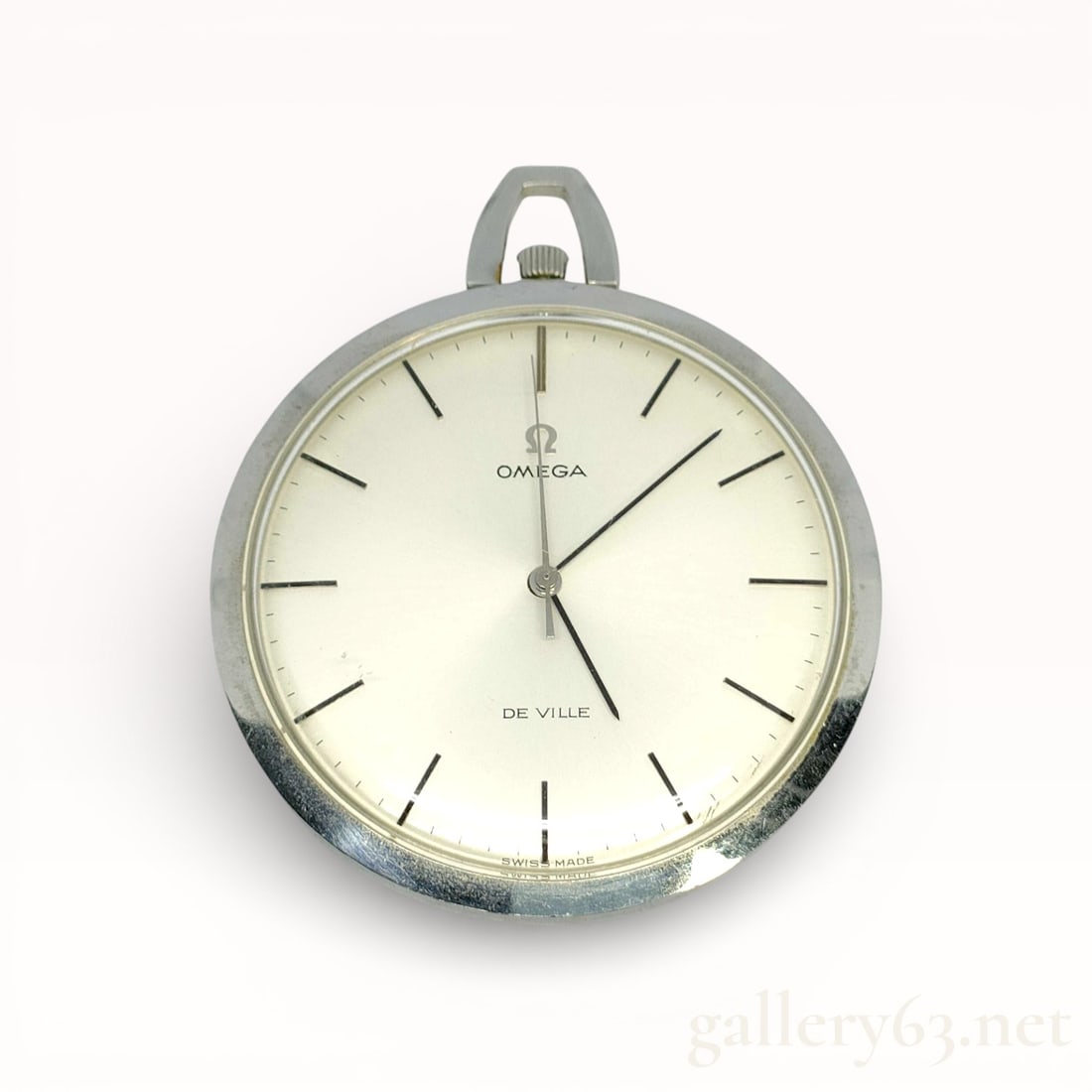 Vintage Omega De Ville Slim Pocket Watch 44mm: Omega De Ville pocket watch presenting a minimalist, refined design. Silver-tone case fitted with a smooth polished finish and suspension loop. Dial finished in a light tone, featuring applied baton h