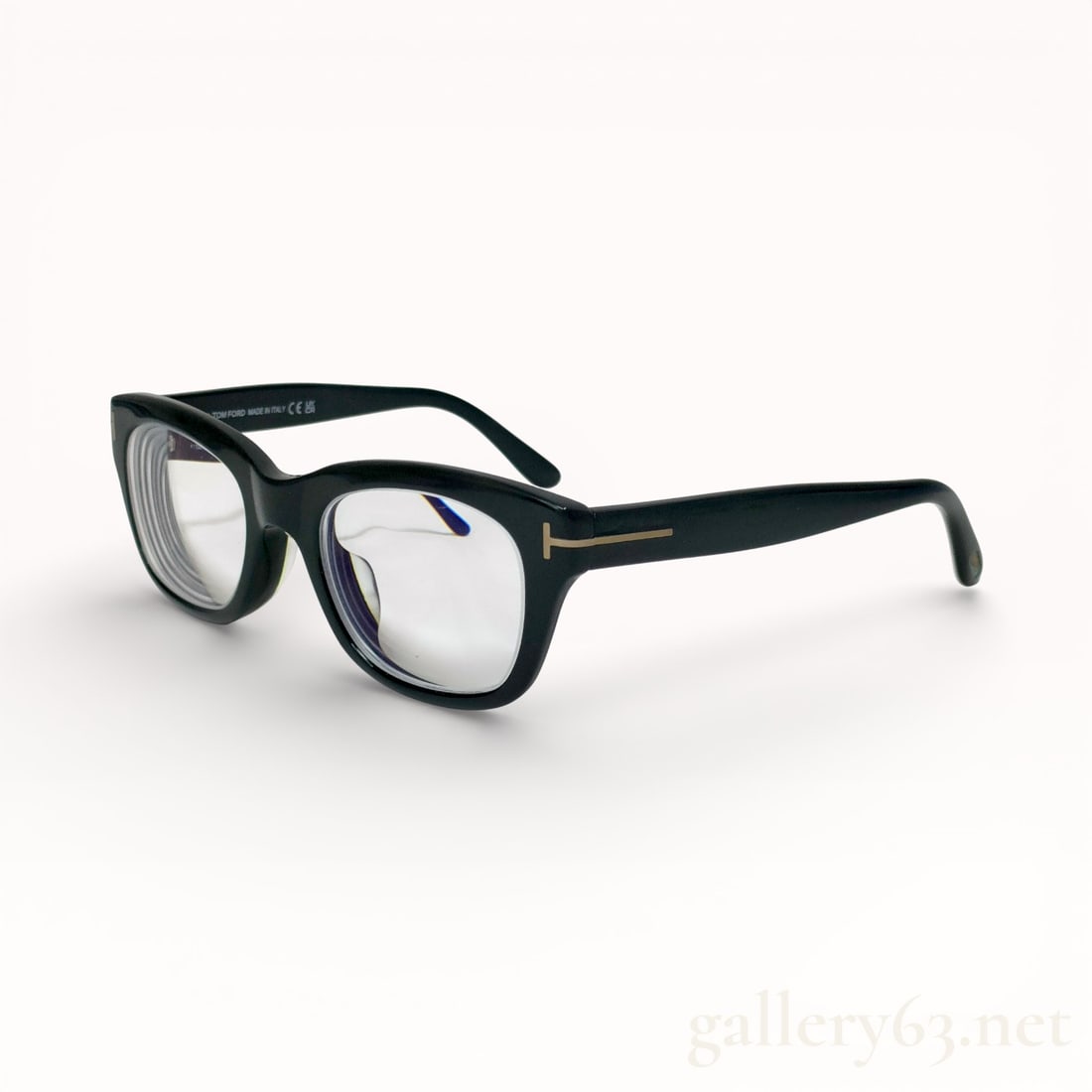 Tom Ford TF8175 Black Optical Eyeglasses: Tom Ford TF8175 eyeglasses featuring a black acetate frame with rectangular lenses. Temples set with the signature metal “T” detail at the hinges. Integrated nose bridge with smooth interior f