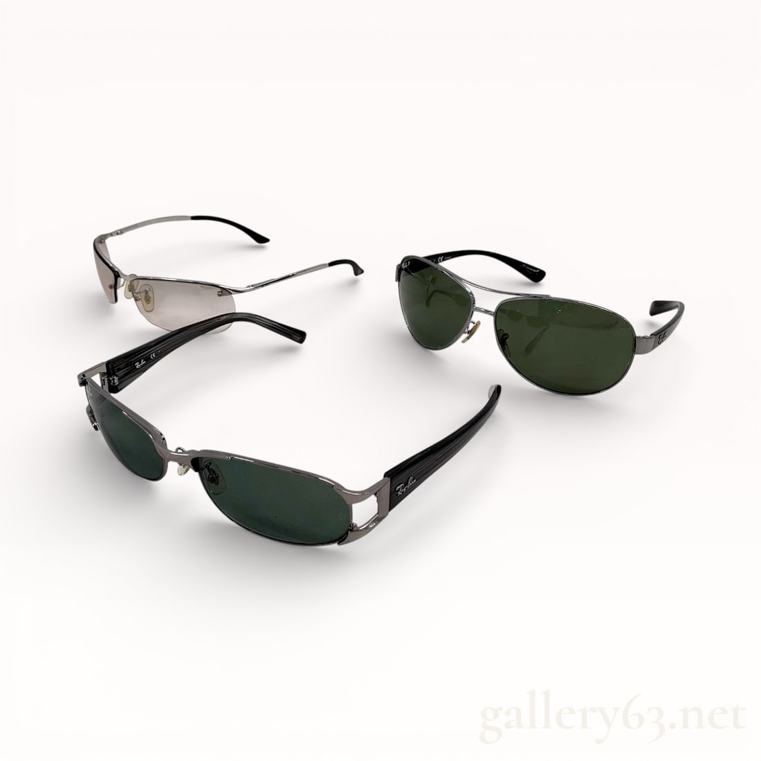 Ray-Ban Sunglasses Three-Piece Set RB3386/RB3396/RB3186: Three Ray-Ban sunglasses presented as a coordinated set. Includes mixed metal and acetate frames in aviator and rectangular profiles. Lenses appear in green and blue tones, set with adjustable nose pa