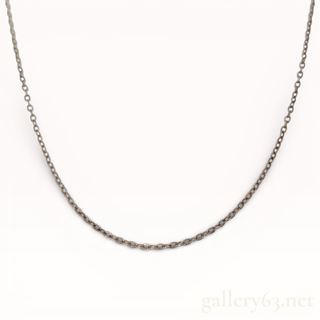 Mikimoto Sterling Silver Chain Necklace 16": Authentic Mikimoto necklace featuring a fine sterling silver chain composed of small uniform links. Necklace forming a delicate continuous profile suitable for wearing alone or with a pendant.