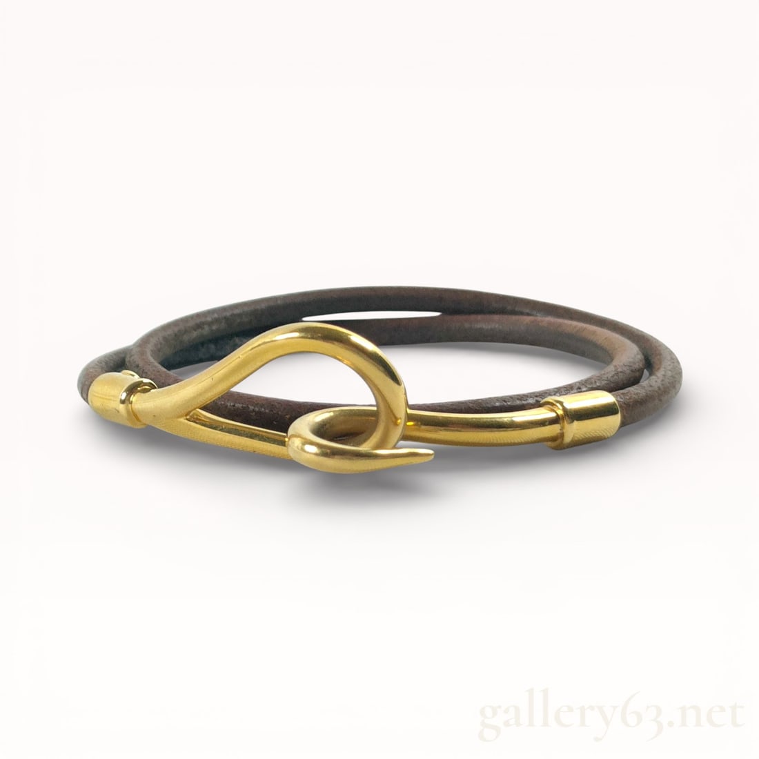 Hermès Jumbo Hook Double Tour Wrap Bracelet: Authentic Hermès Jumbo Hook double tour wrap bracelet in brown leather with a gold-plated hook closure. 