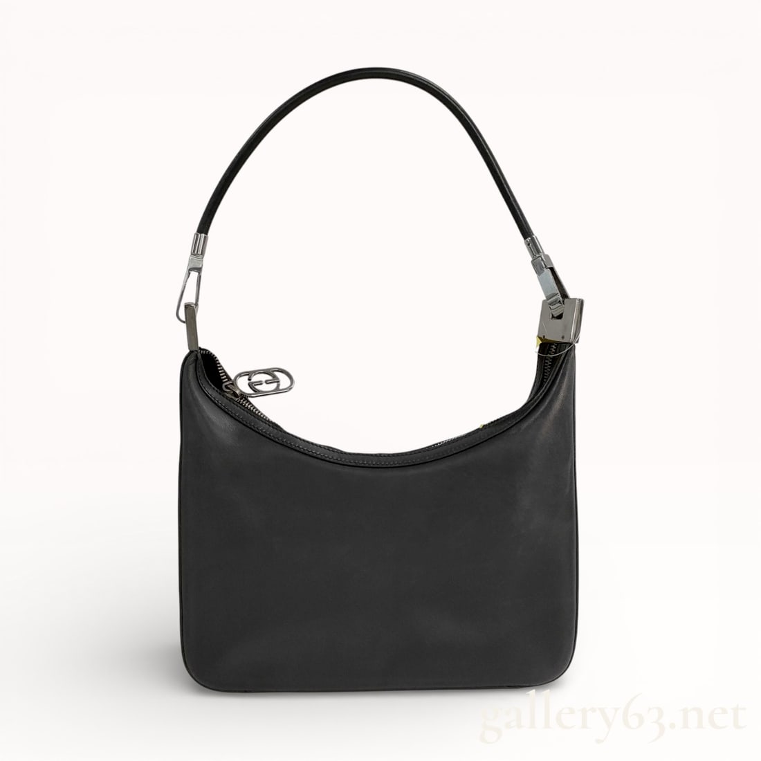 Gucci One-Shoulder Leather Bag, Model 001.3812: Authentic Gucci one-shoulder bag crafted in smooth black leather, presenting a compact, softly structured silhouette. Single leather shoulder strap fitted with polished metal hardware and adjustable
