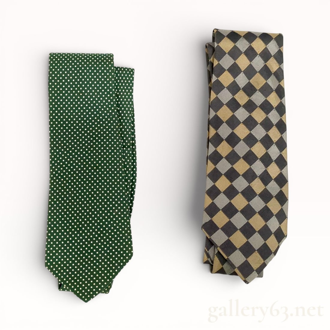 Hermès Silk Tie Set, Two Pieces: Hermès two-piece silk necktie set comprising ties in contrasting patterns and colorways. Group includes one tie featuring a green ground with small repeating dot motif and one tie presenting a geomet