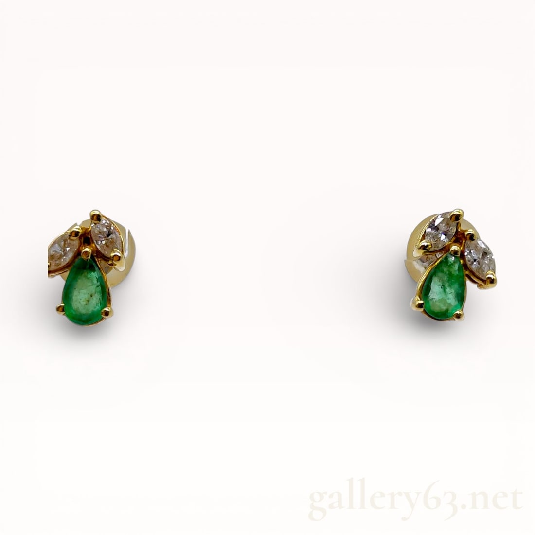 18k YG Emerald and Diamond Earrings: Pair of 18k yellow gold pear shaped emerald and natural white diamond earrings. 