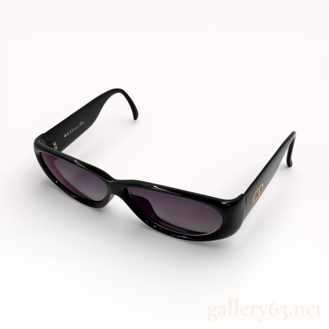 Vintage Dior Black Acetate Sunglasses: Authentic vintage 1990s Christian Dior black acetate sunglasses with CD gold logo crest. 