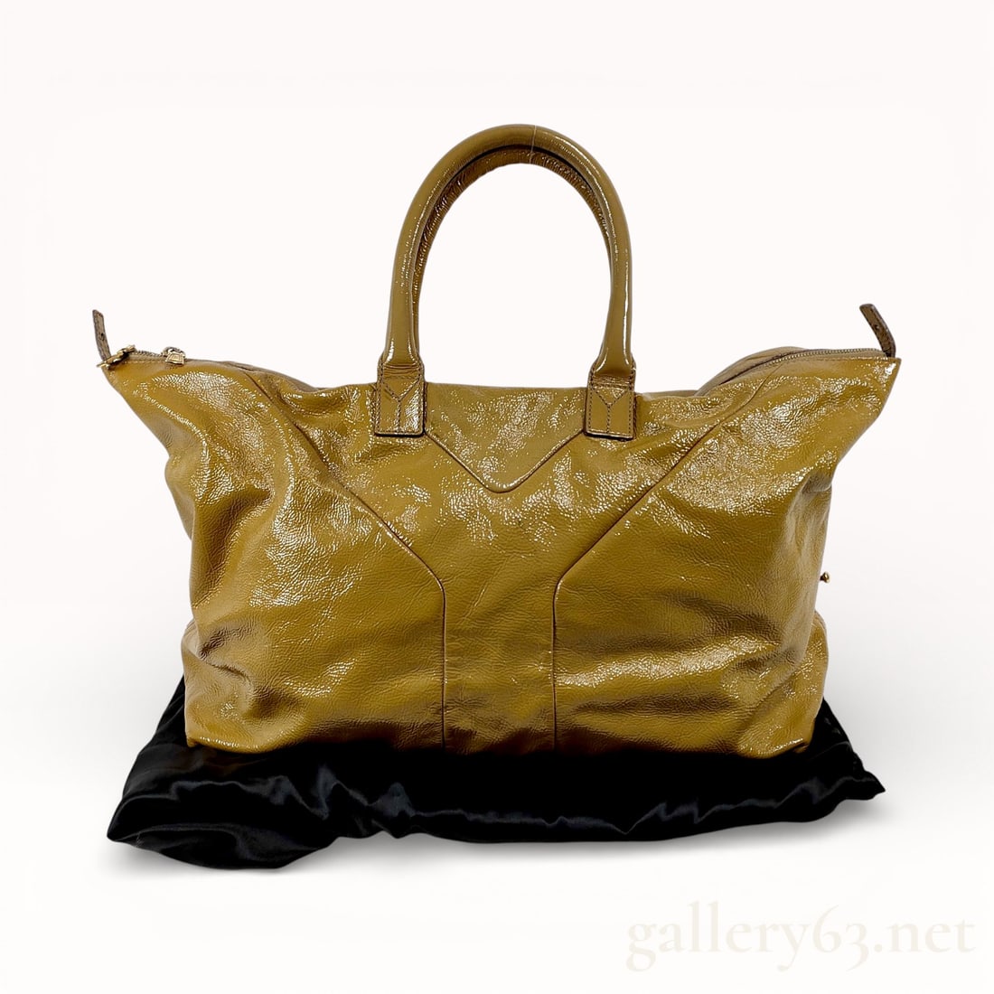 Yves Saint Laurent Enamel Leather Tote Bag: Authentic Yves Saint Laurent tote bag having an enamel-finish leather exterior in an olive-brown tone. Featuring a softly structured silhouette with signature Y-panel seam construction across the fron