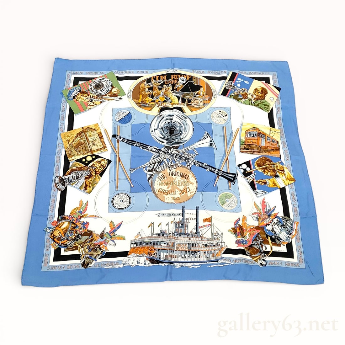 Hermès New Orleans: The Original Creole Jazz Silk Carré Scarf 90: Hermès silk carré scarf featuring the New Orleans: The Original Creole Jazz design, printed in shades of blue, cream, black, gold, and multicolor. Central composition presents musical instruments an