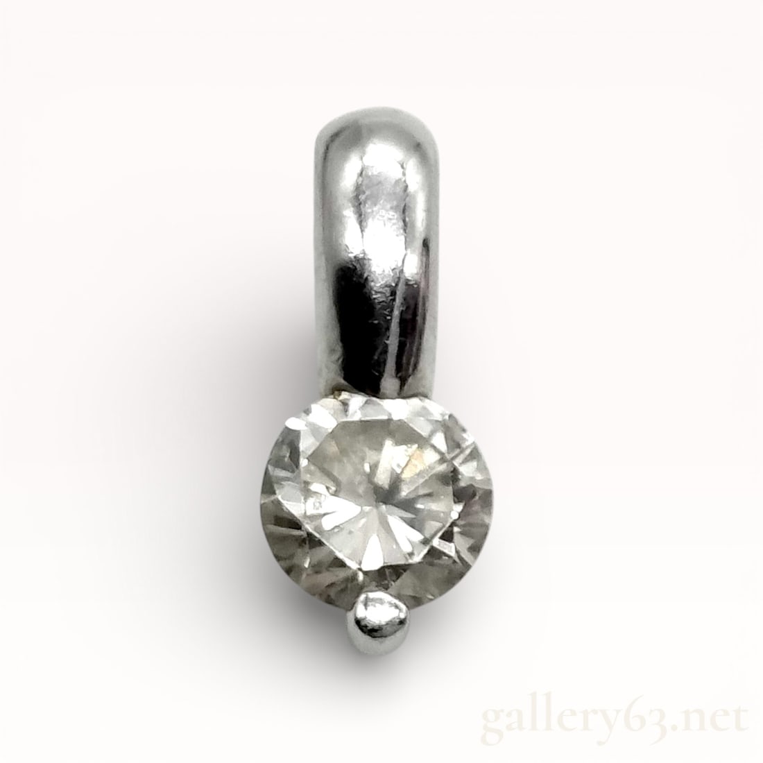 Platinum Natural .37ct Diamond Solitaire Pendant: Platinum pendant top set with a single round brilliant-cut diamond weighing approximately 0.37 carats. Polished platinum setting having a compact, minimalist profile with a smooth integrated bail. Mar