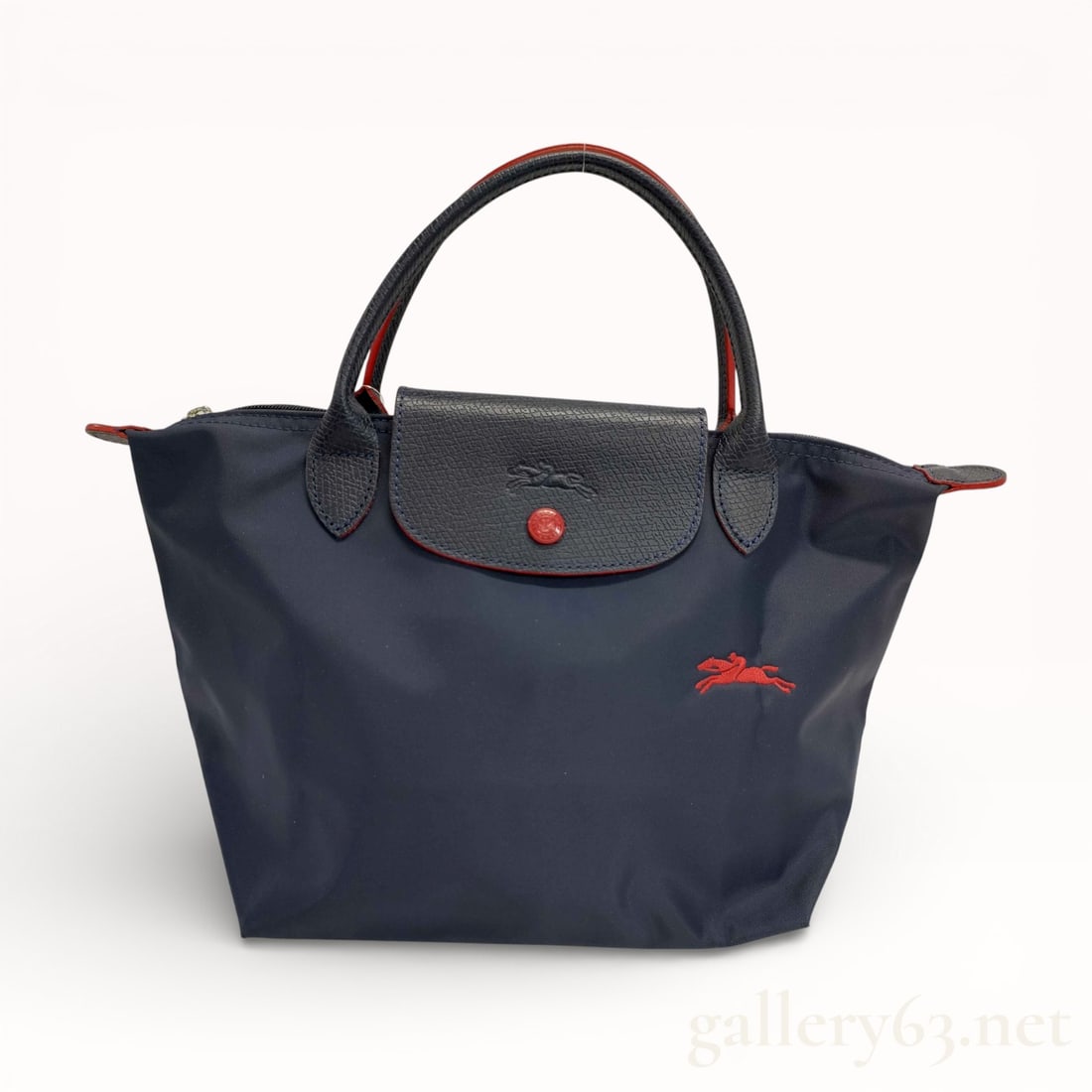 Longchamp Le Pliage Black and Red Trim Nylon and Leather Tote Bag: Authentic striking black nylon and leather Longchamp Le Pliage tote bag with bright red accent trim and aged ruthenium hardware. 