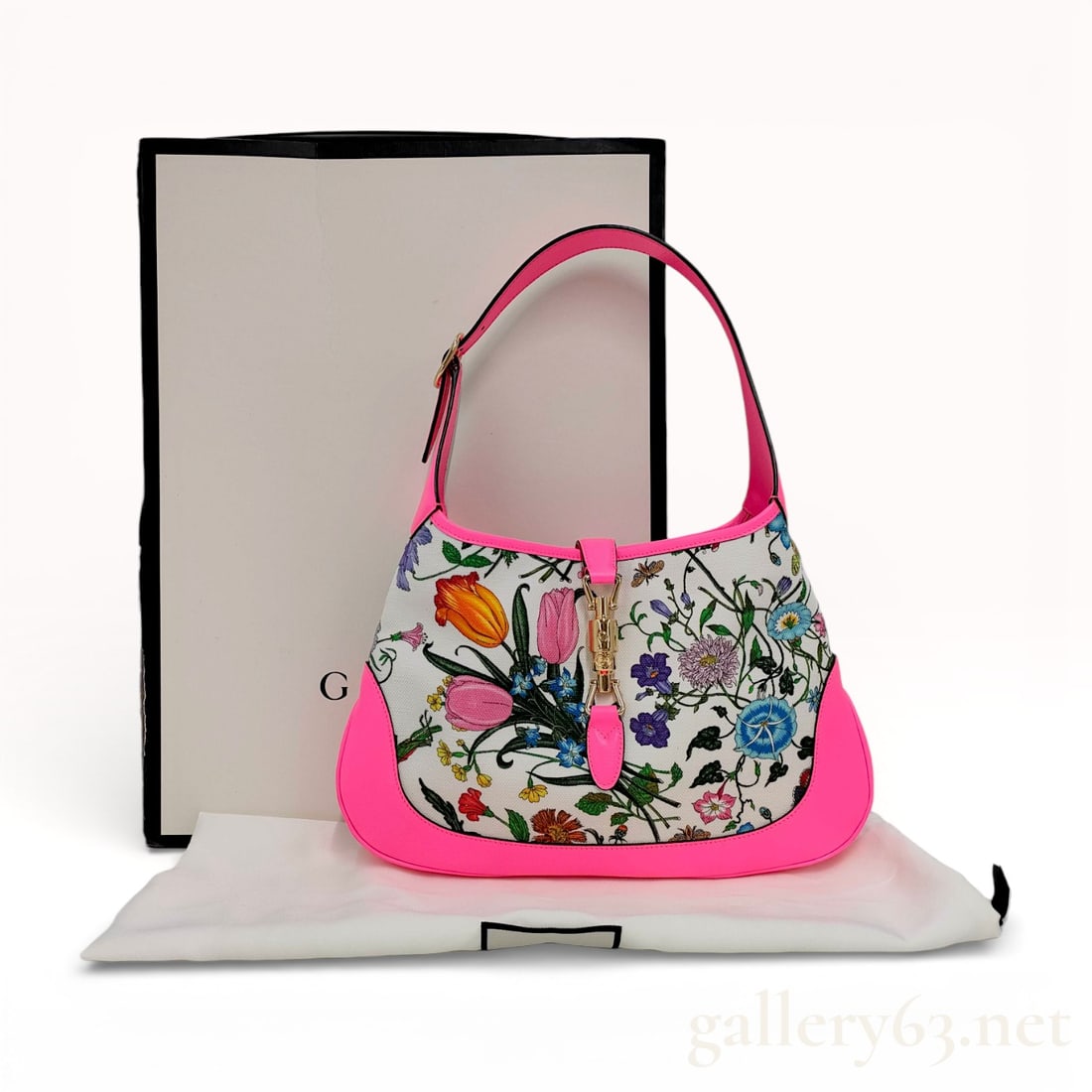 Gucci Jackie Floral Gucci 1961 Bag - Like New: Gucci medium Jackie 1961 bag featuring a canvas body with multicolor floral print throughout, neon pink leather panelling, gold tone hardware, single flat adjustable top handle, strap across top with