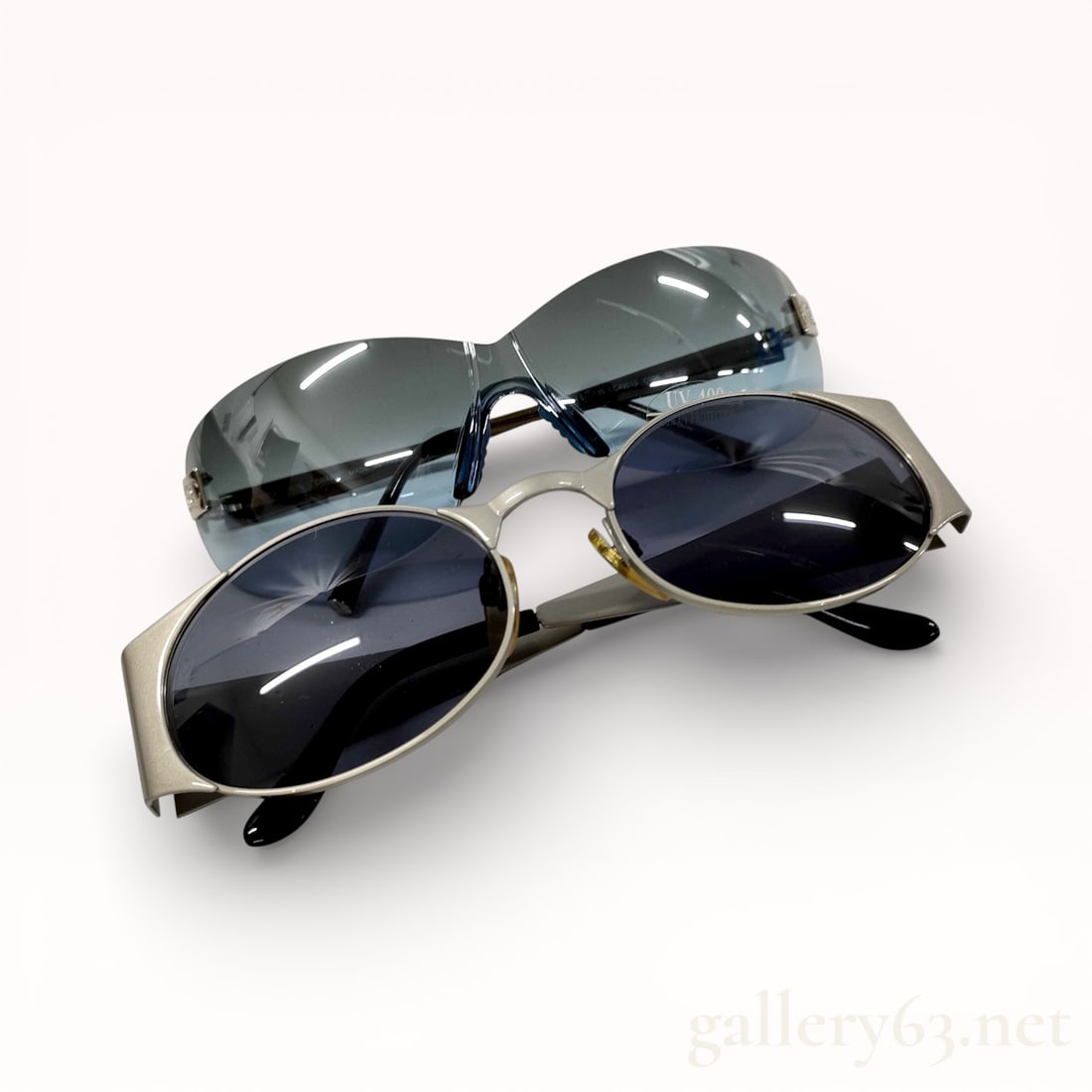 Chanel Two-Pair Sunglasses Set with Box 06926/52-20 2 Pieces: Authentic set of two Chanel sunglasses presented together. One pair featuring a rimless shield-style design with gradient lenses and minimal metal fittings. Second pair featuring oval lenses set withi