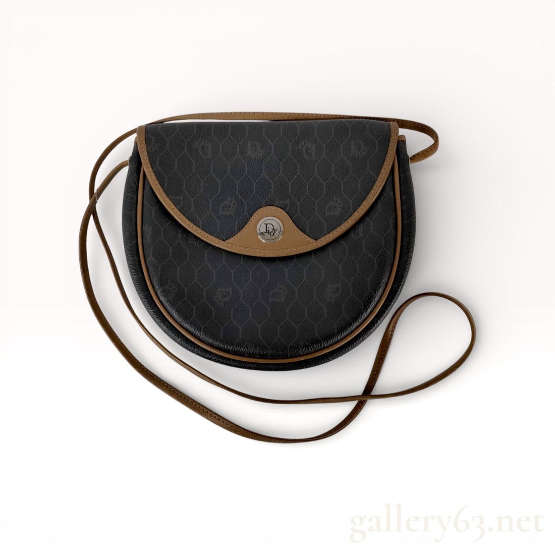 Dior Honeycomb Shoulder Bag: Christian Dior shoulder bag having a black honeycomb monogram canvas exterior with contrasting tan leather trim. Rounded saddle-style silhouette featuring a front flap with curved leather edging and a