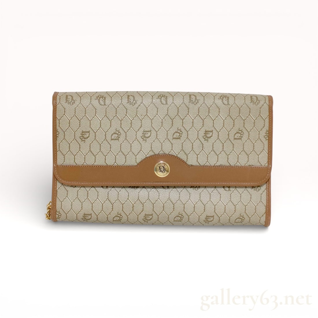 Dior Honeycomb Chain Shoulder Bag: Christian Dior chain shoulder bag featuring a beige honeycomb-patterned coated canvas exterior. Surface set with repeating Dior monogram motifs throughout. Front flap trimmed in tan leather and secure