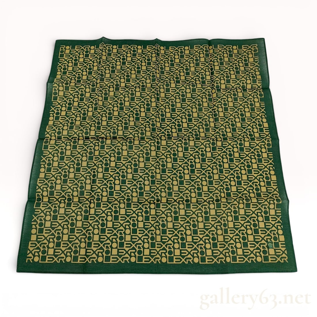 Rolex Green and Gold Logo Motif Handkerchief: Authentic Rolex handkerchief woven or printed in a repeating geometric logo pattern, executed in gold-toned lettering against a deep green ground. Finished with a contrasting green border framing the