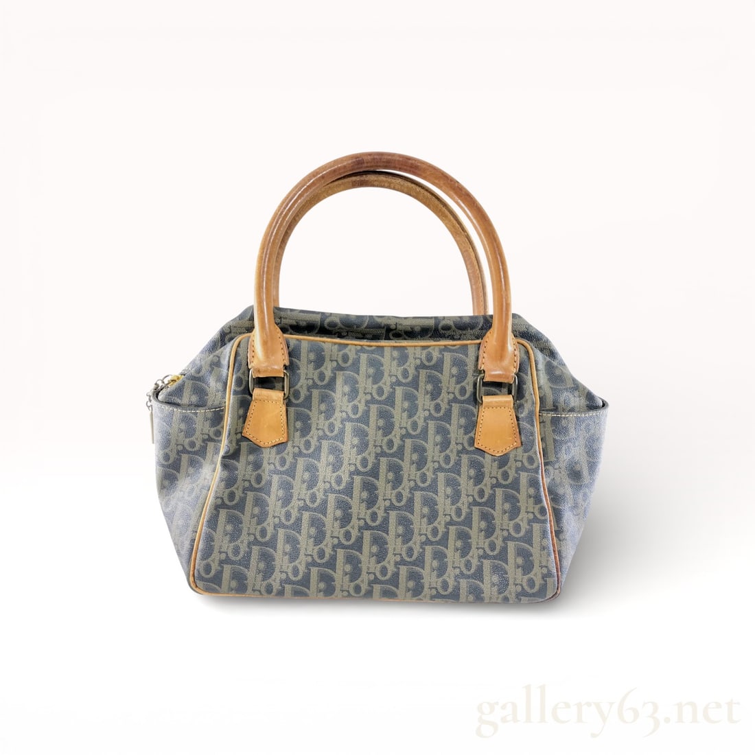 Christian Dior Trotter Vintage Leather Boston Bag: Dior Trotter Vintage Boston Bag Description Christian Dior vintage Boston-style handbag crafted in blue Trotter monogram PVC. Body featuring repeating Dior logo pattern throughout. Trim and dual