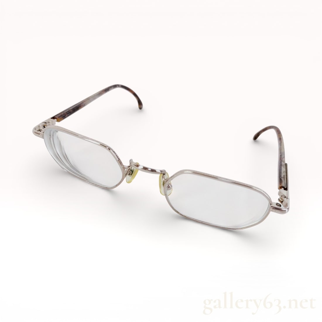 Montblanc Rectangular Metal Prescription Glasses: Authentic Montblanc prescription glasses featuring a refined rectangular lens shape within a slim metal frame. The design presents articulated nose pads, discreet hinge detailing, and gently curved te