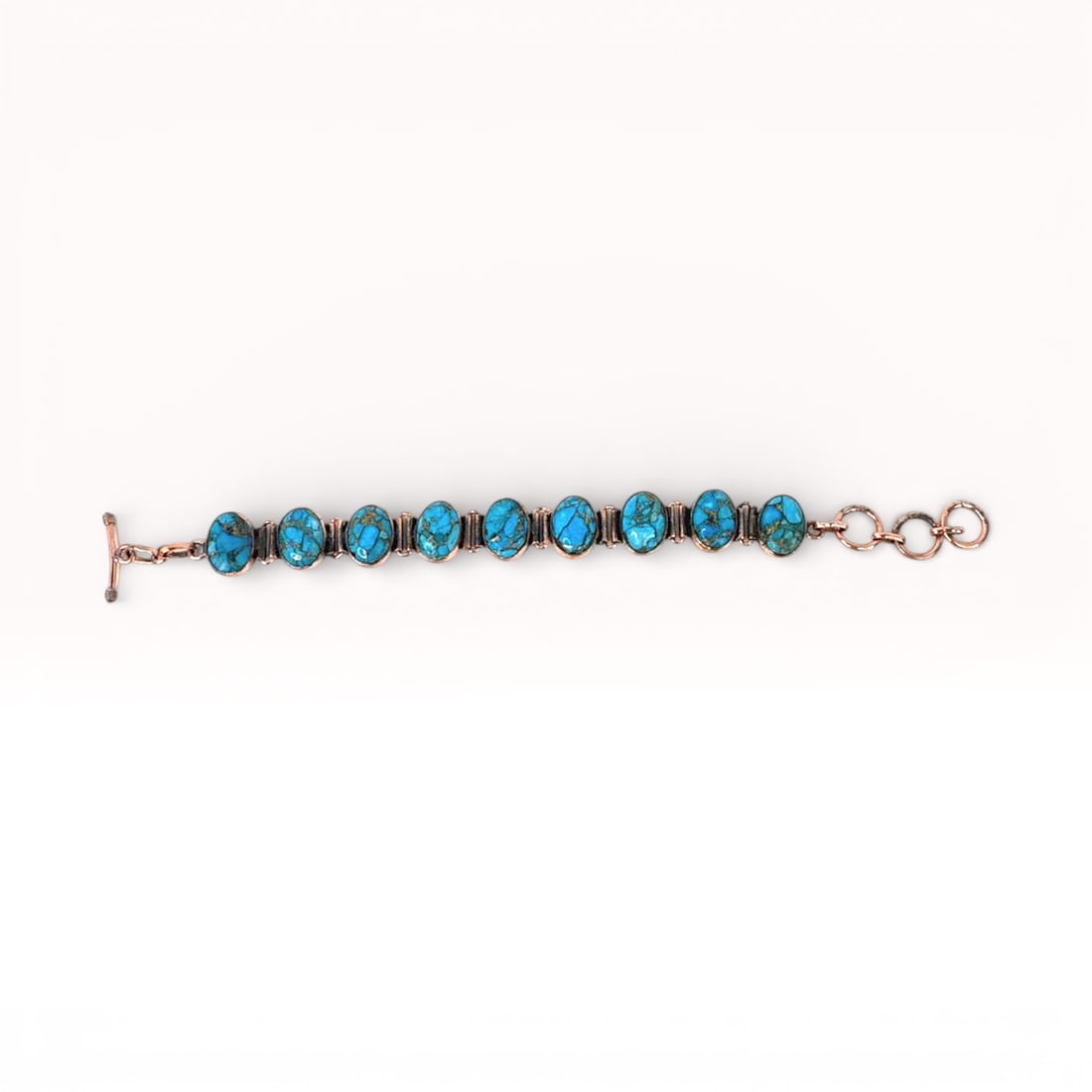 Blue Howlite Cabochon Bracelet Copper: cabochon turquoise blue howlite bracelet set in copper. 8 inches overall.