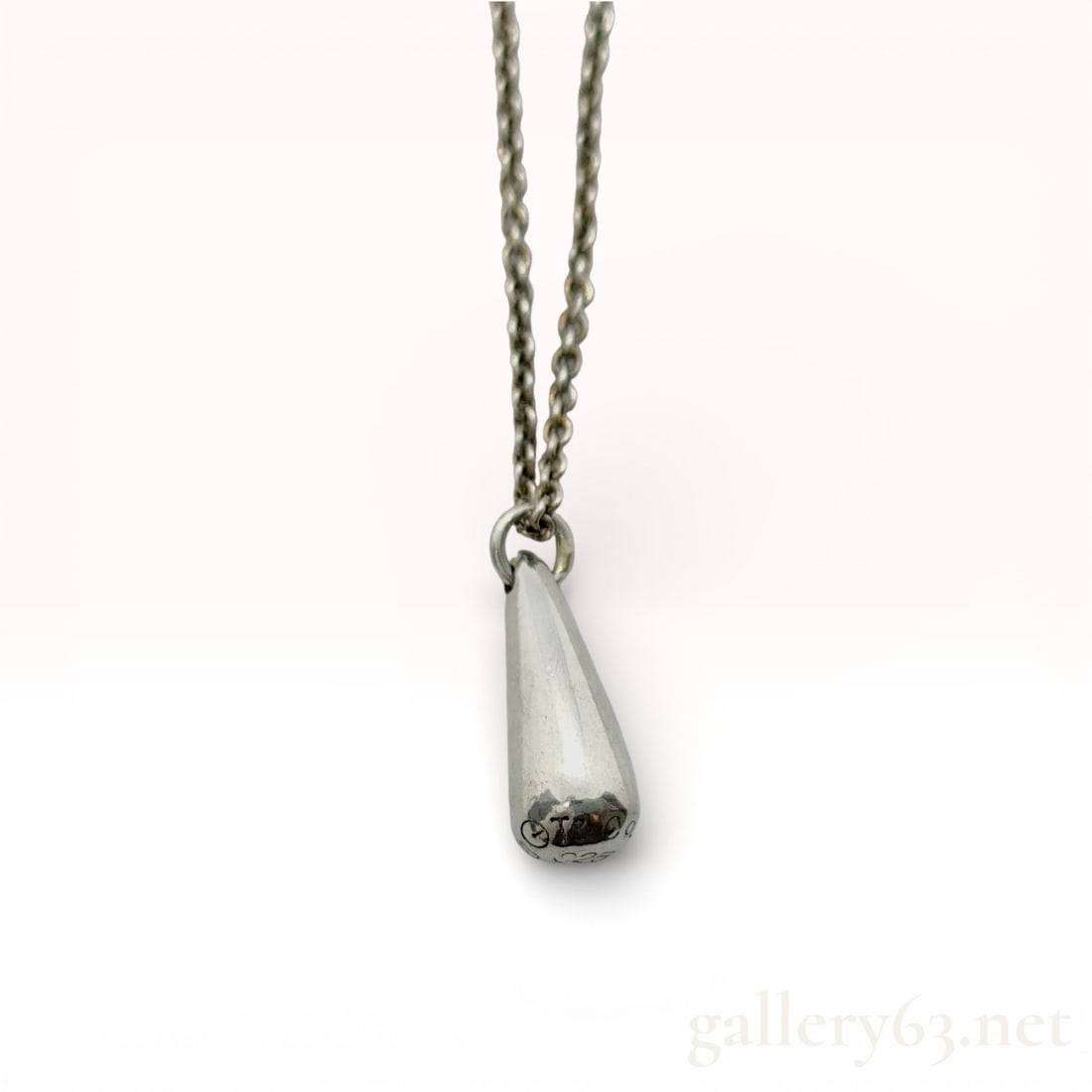Tiffany & Co. Sterling Silver Teardrop Pendant Necklace: Auth. Tiffany & Co. Sterling silver necklace having a polished teardrop-shaped pendant suspended from a fine silver chain. Pendant featuring a smooth, elongated form with a rounded base and tapere