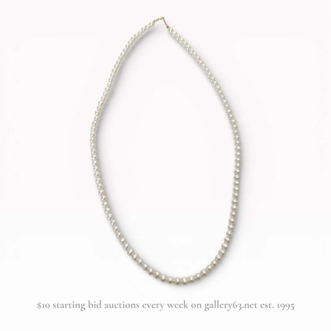 Pearl Necklace with 18K Yellow Gold Clasp: Strand of pearls featuring an 18K yellow gold clasp marked 18K. Weighing approximately 9.7g. 